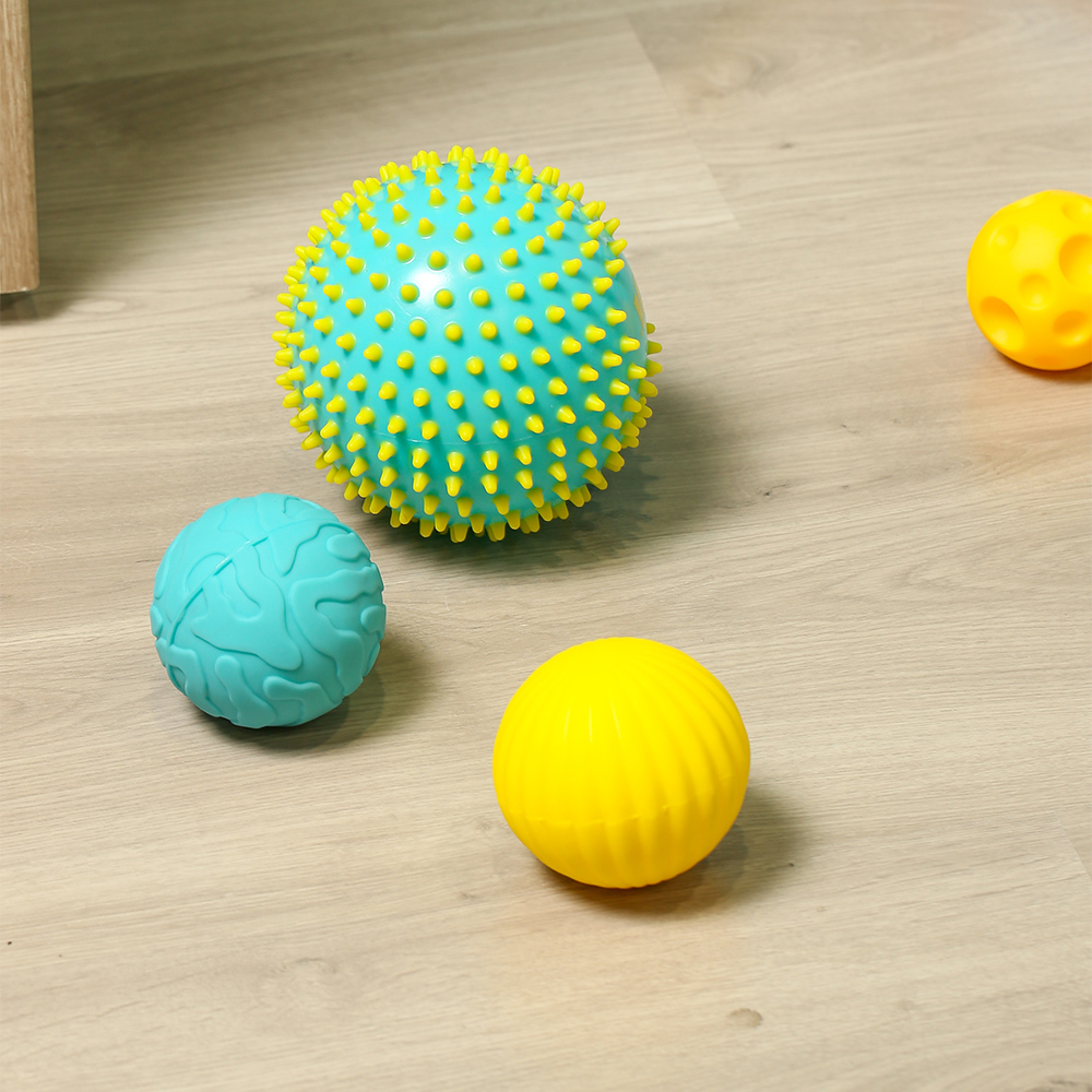 PELOTA SENSORIAL TURQ./AMAR.